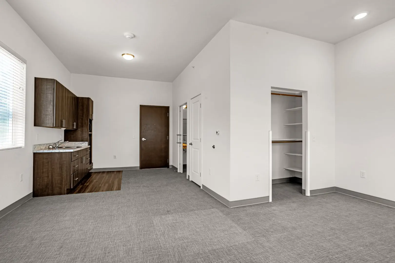 Studio apartment looking towards door.